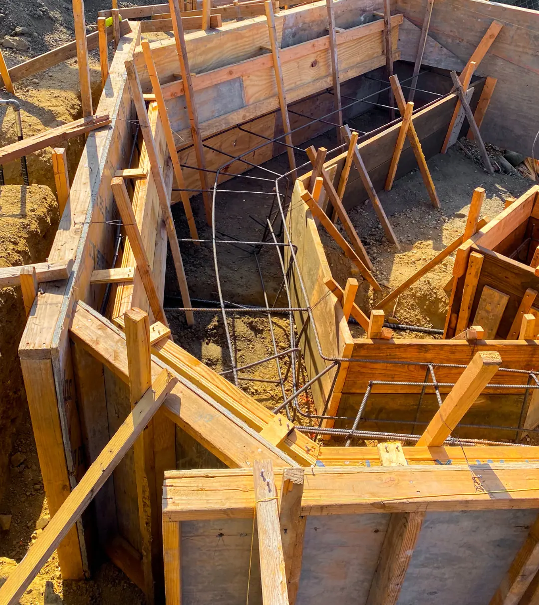 Rebar cages and timber formwork set for a cast-in-place concrete bench