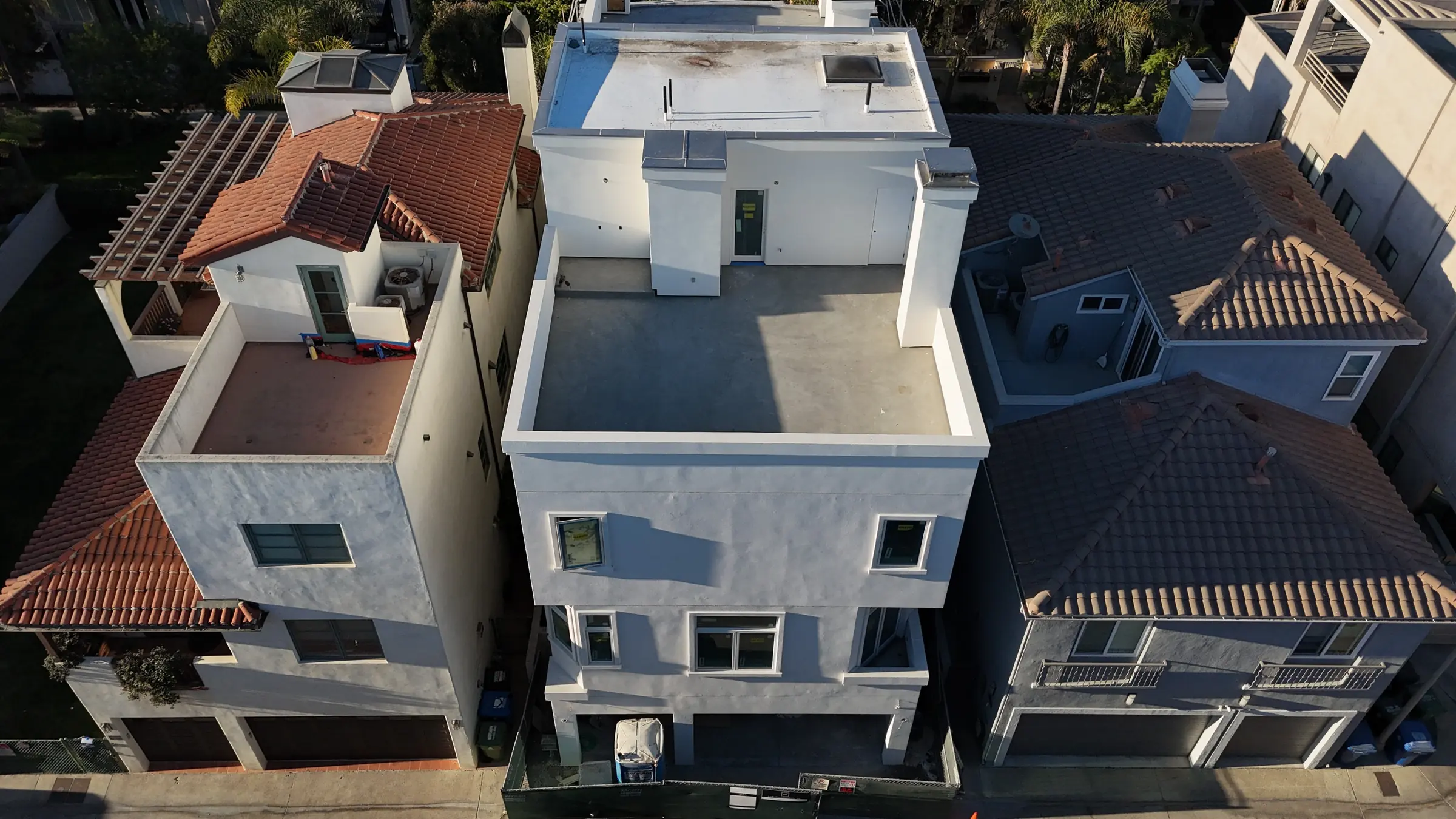 Aerial view over a coastal Los Angeles neighborhood during a Ludi renovation