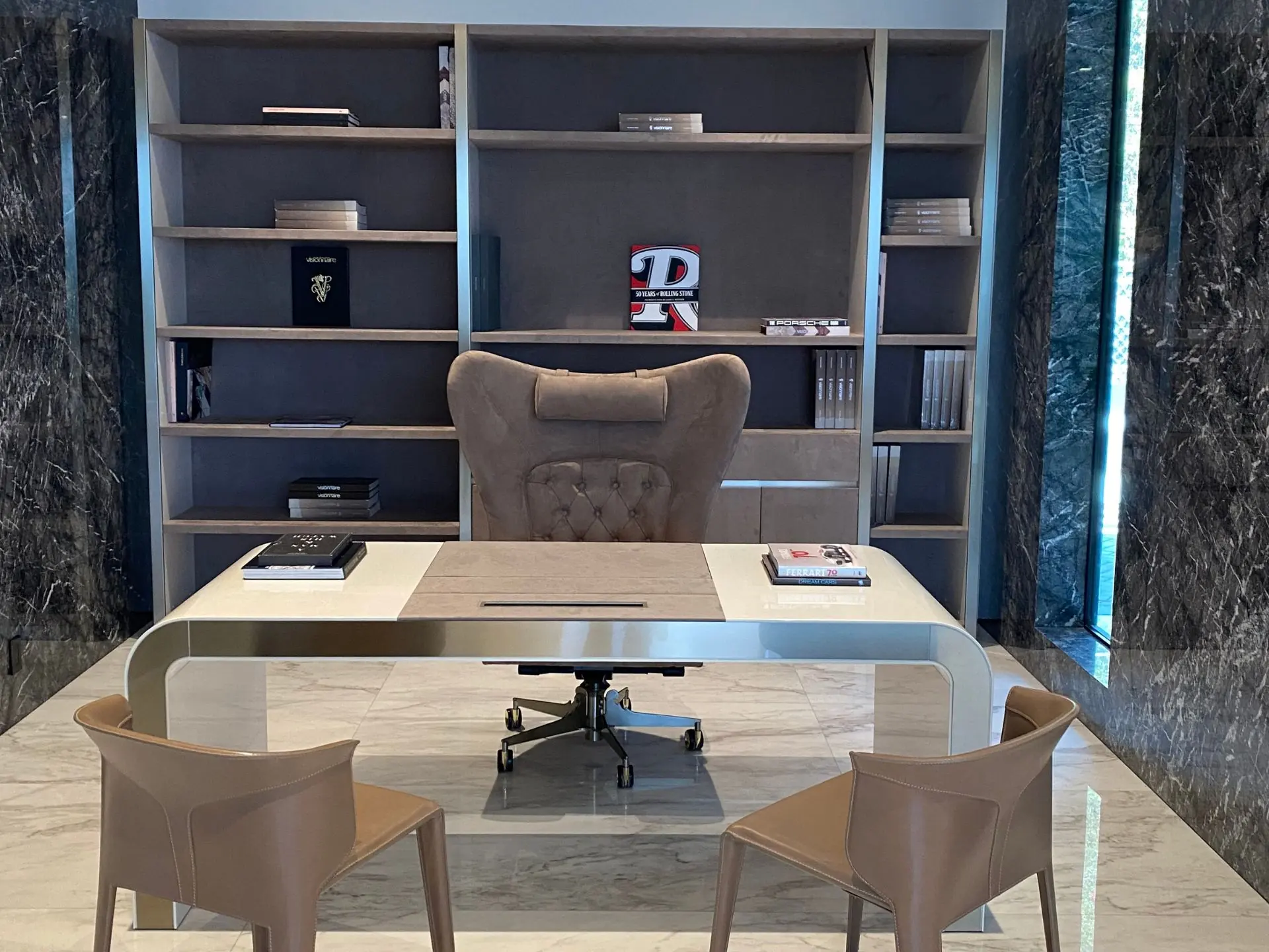 Completed office interior with full-height stone, custom shelving and a boardroom table