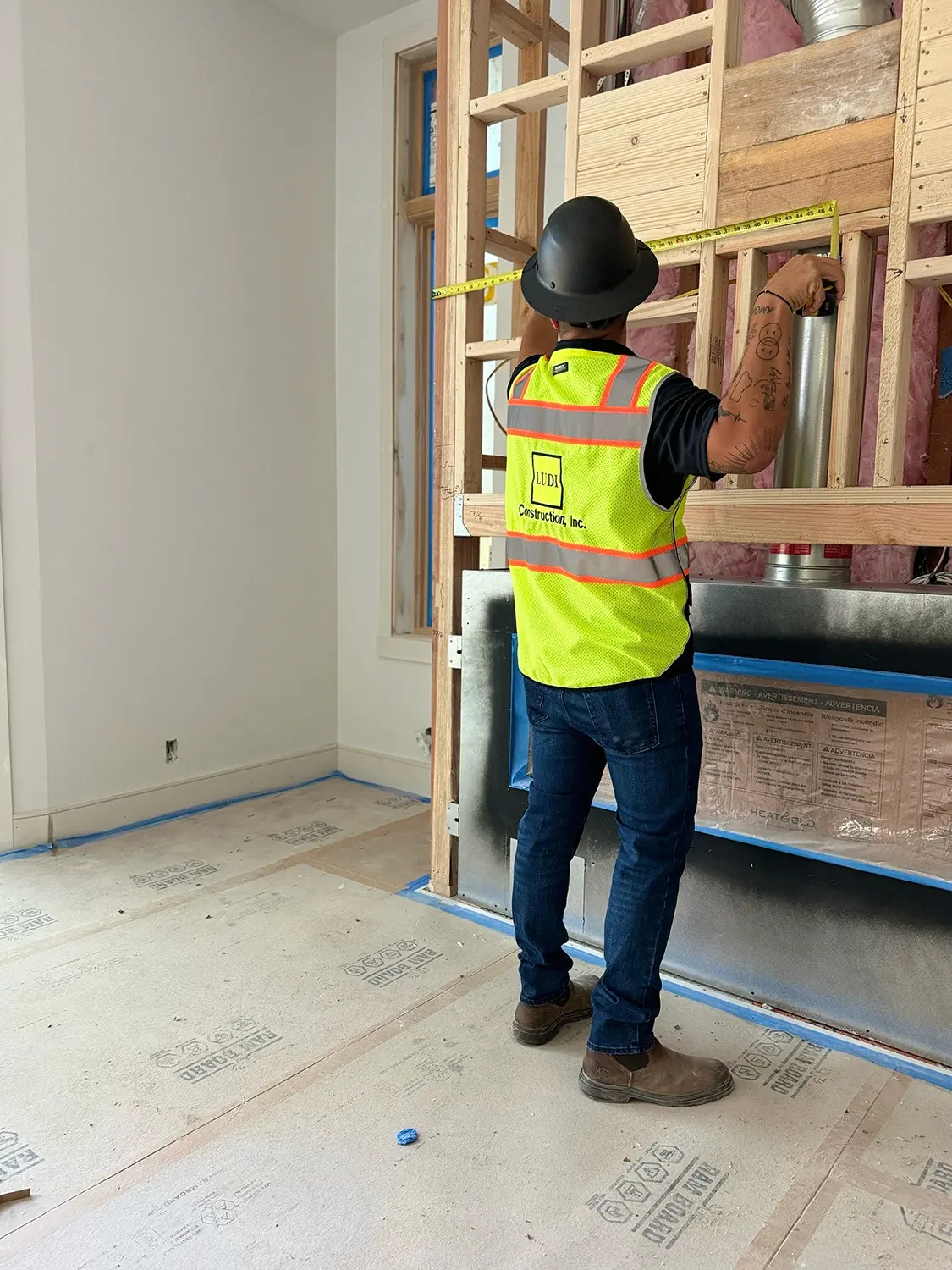 Ludi team member checking dimensions during an interior renovation
